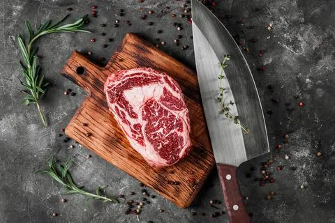 Meat processing plant. carcasses of beef hang on hooks. Stock Photos