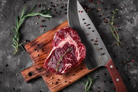 Meat processing plant. carcasses of beef hang on hooks. Stock Photos