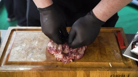Meat raw steak cooking process by cook chef hands on kitchen. Food concept. Stock Footage 125560812