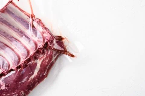 Meat rib in plastic pack set, on white stone table background, top view flat  Stock Photos