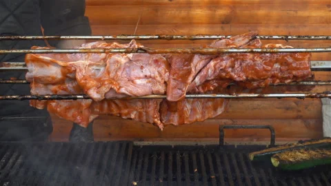 The meat ribs are fried rotating on a grill in 4K. Stock Footage 125467848