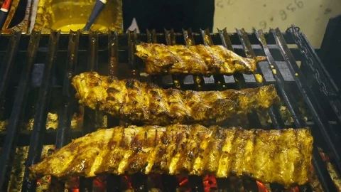 Meat ribs, roasted on the grill, brush with sauce Video stock 84252935
