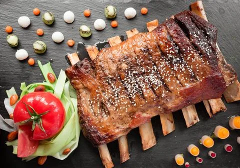 Meat ribs with vegetables Stock Photos
