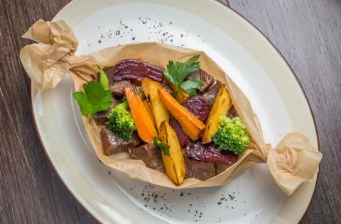 Meat roasted with potatoes Stock Photos