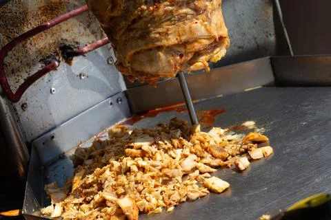 Meat roasted on a vertical spit Fotos Stock