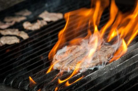 Meat roasting on the grill Stock Photos