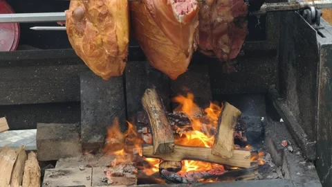 Meat Roasting Over Open Wood Fire Rustic BBQ Cooking Process 4K Stock Footage 332162867