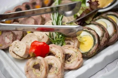 Meat roll with the cherry tomato Stock Photos