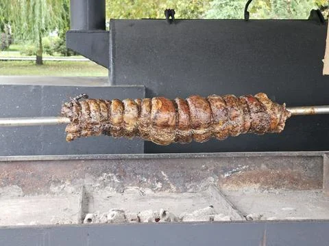 Meat roll on a spit, authentic cuisine Stock Photos