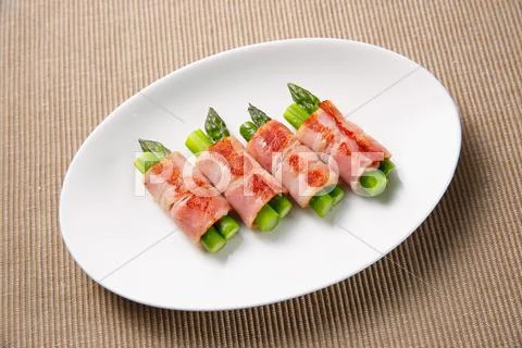 Meat-rolled asparagus Stock Photos