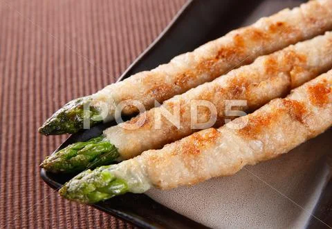 Meat-rolled asparagus Stock Photos
