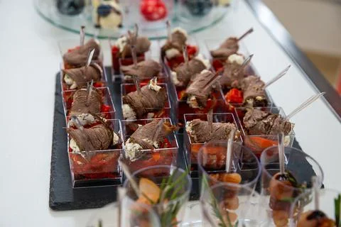 Meat rolls at a buffet table. canapes. copyspace Stock Photos