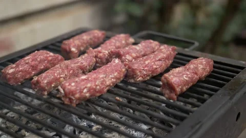 Meat Rolls on the grill with charcoal Stock Footage 152585942