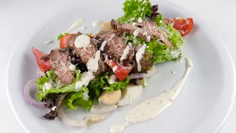Meat salad with roast beef, parmesan cheese, tomatoes, eggs and sauce Stock-Footage 81003926