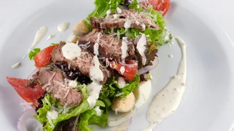 Meat salad served in Restaurant, includes roast beef, parmesan cheese Vídeos de archivo 81003913