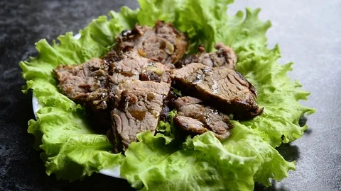 Meat on the salade leafs. Pouring sauce. Stock Footage 74872419