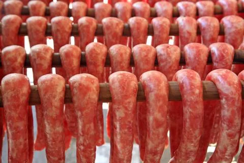 Meat sausages during produced process Stock Photos