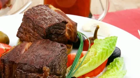 Meat savory : beef fillet mignon grilled and garnished with baked apples Stock Footage 21761890