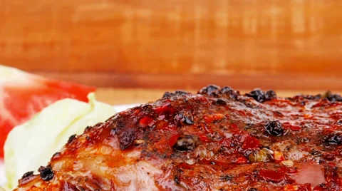 Meat savory on table : roast shoulder with tomato Vídeos de archivo 30349034