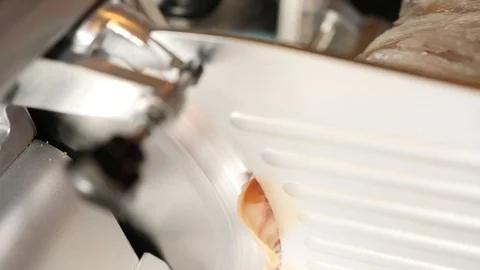 Meat slicing machine cuts finished processed meat products. Electric food slicer Stock Footage 104075439