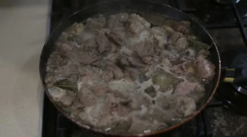 Meat with spices fried in a pan Stock Footage 64975434