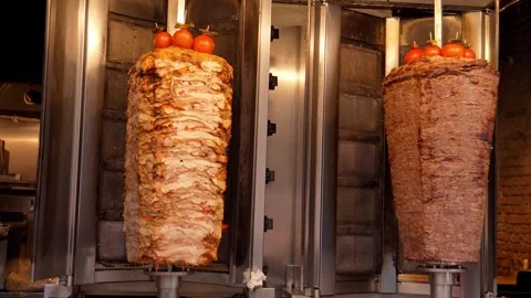 Meat on spit for Shawarma. Grilled meat. Cooking. Stock Footage 255603592