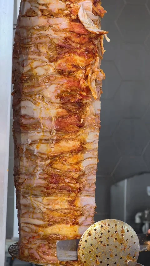 Meat on spit for Shawarma. Grilled meat. Cooking. Stock Footage 314371441