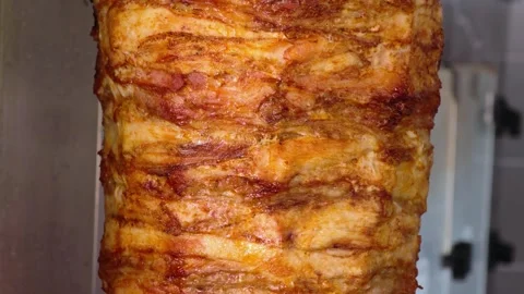 Meat on spit for Shawarma. Grilled meat. Cooking. Stock Footage 314372679