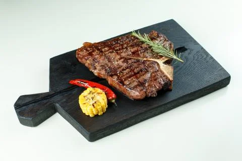 Meat steak on the board Stock Photos