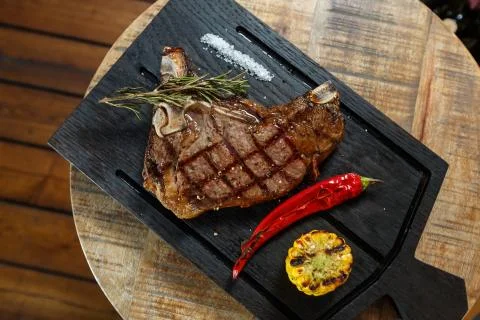 Meat steak on the board Stock Photos
