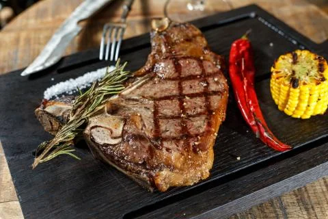 Meat steak on the board Stock Photos
