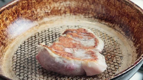 Meat steak fried in a pan Stock Footage 153227844