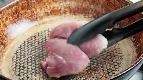 Meat steak fried in a pan Stock Footage 153227874