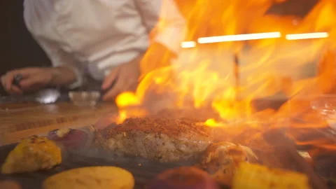 Meat Steak At Modern Kitchen On Grill Closeup. Flame Fire In Grill Frying Pan. Stock Footage 142817960