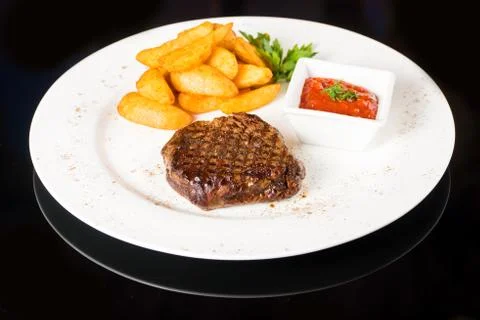 Meat  steak with potatoes Stock Photos
