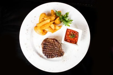 Meat  steak with potatoes Stock Photos
