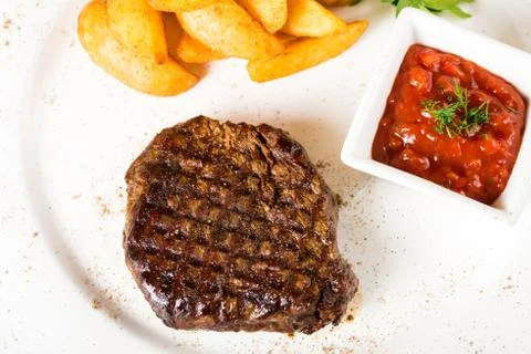Meat  steak with potatoes Stock Photos