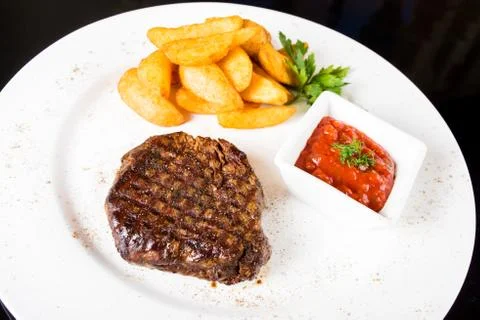 Meat  steak with potatoes Stock Photos