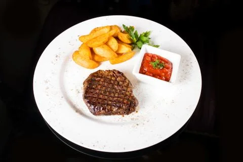 Meat  steak with potatoes Stock Photos