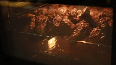 Meat steaks is baked in the oven Stock Footage 111072453