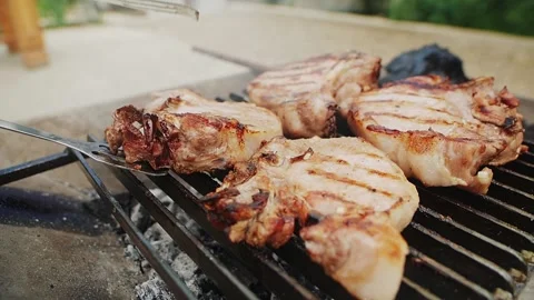 Meat steaks on barbeque grid Stock Footage 159293205