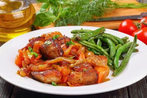 Meat stew with vegetables on plate Foto stock