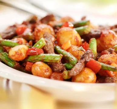 Meat strips with beans pepper potato and  tomato sauce Stock Photos