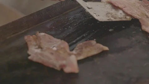 Meat Strips Sizzling and Flipped on Griddle at Sydney Market Food Stall Stock Footage 345712861