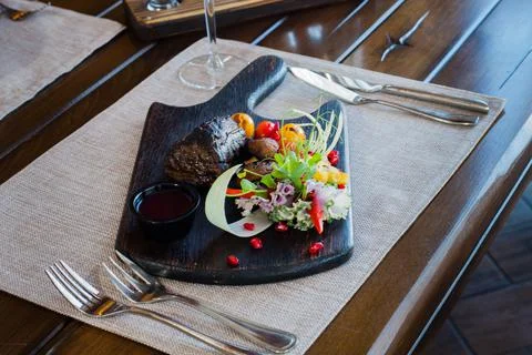 Meat on the table in a restaurant Stock Photos