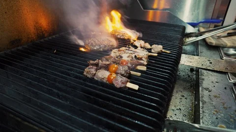 Meat on tre grill in the restaurant Stock Footage 89057410