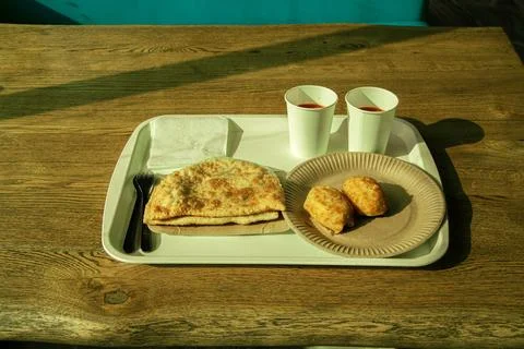 Meat triangular pie.Take it out of the oven.Hot dog.Vakbelyash.Bakery.National M 스톡 사진