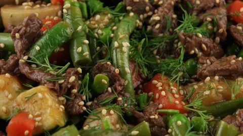 Meat with vegetables in a frying pan Stock Footage 58495978
