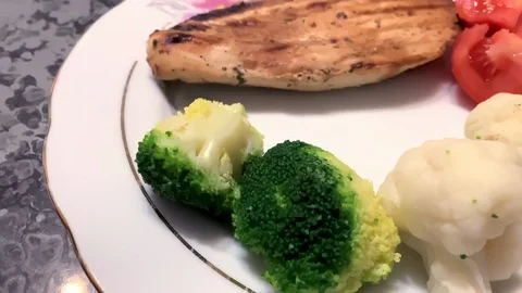 Meat with vegetables on a plate in a restaurant Stock Footage 126004439
