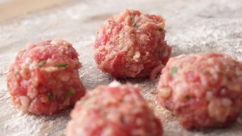 Meatball on a board with flour. Stock Footage 255664755